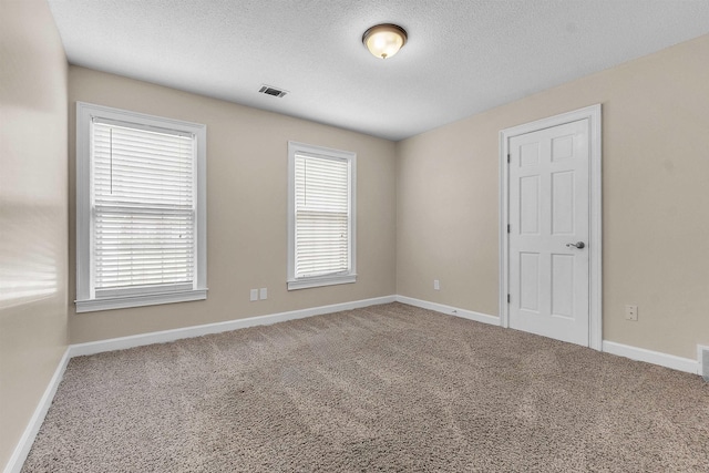 345 Locust Grove Grv, Memphis, TN 38018 - unfurnished room featuring carpet flooring, baseboards, and a textured ceiling