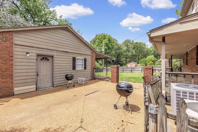 345 Locust Grove Grv, Memphis, TN 38018 - view of patio featuring fence, area for grilling, and cooling unit