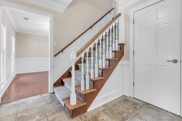 345 Locust Grove Grv, Memphis, TN 38018 - stairs with crown molding, a decorative wall, a wainscoted wall, and stone finish flooring
