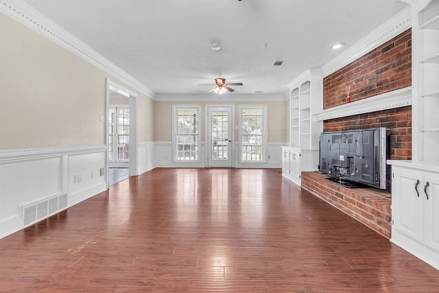 345 Locust Grove Grv, Memphis, TN 38018 - unfurnished living room with ceiling fan, plenty of natural light, ornamental molding, a wainscoted wall, and wood finished floors