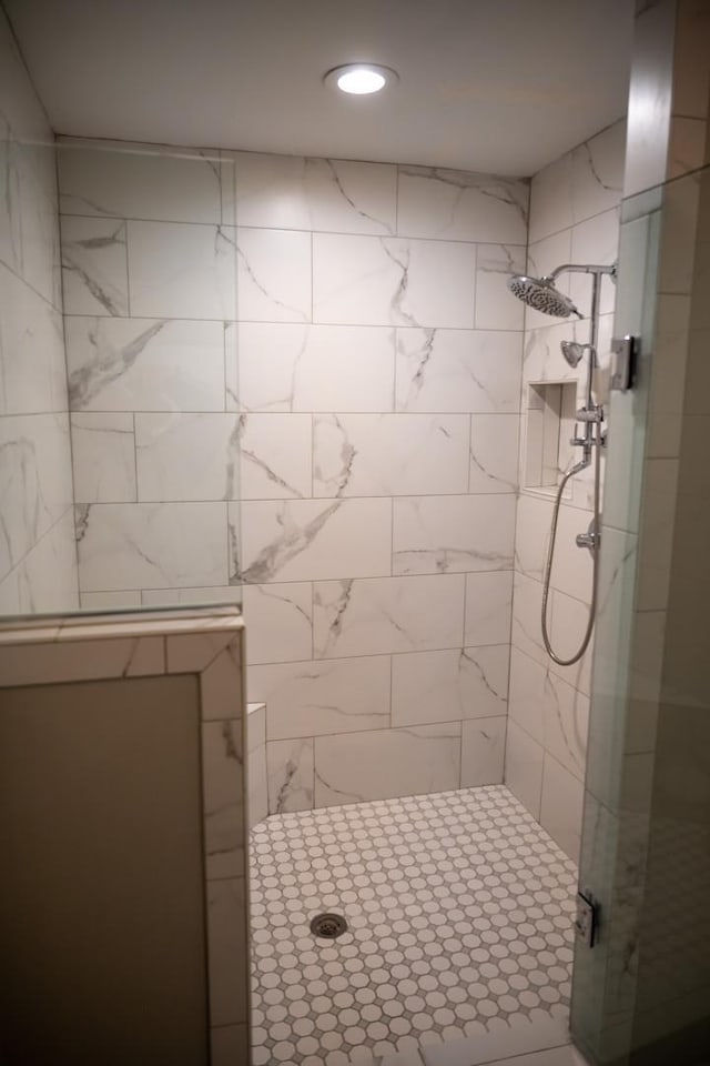 full bathroom featuring a shower stall