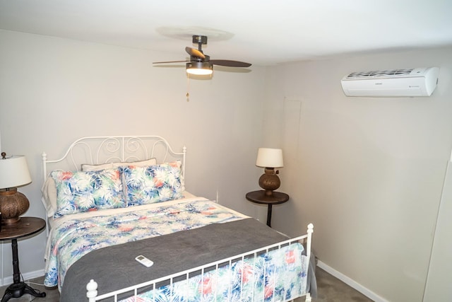bedroom with a wall mounted AC, baseboards, ceiling fan, and carpet