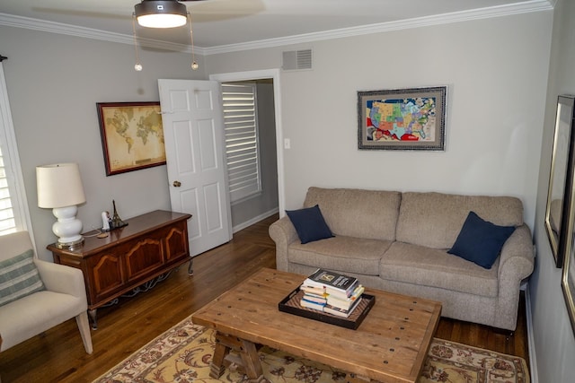 living area featuring ornamental molding, wood finished floors, and a ceiling fan