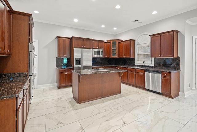 kitchen with appliances with stainless steel finishes, a sink, baseboards, recessed lighting, and light marble finish flooring