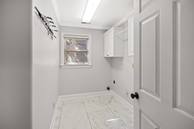 washroom with electric dryer hookup, cabinet space, marble look tiles, baseboards, and ornamental molding