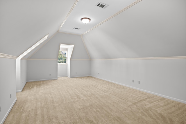 additional living space featuring carpet floors, baseboards, and lofted ceiling