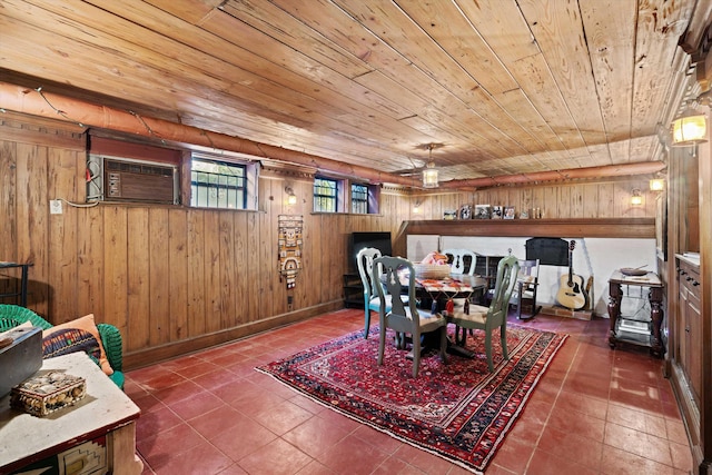 14 Morningside Pl, Memphis, TN 38104 - dining area with wooden ceiling, a wall mounted AC, wood walls, and tile patterned floors