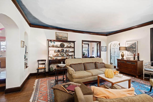 14 Morningside Pl, Memphis, TN 38104 - living room with arched walkways, crown molding, dark wood-style floors, and baseboards