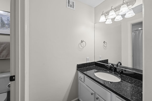 full bathroom with vanity and toilet