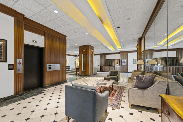 common area featuring a drop ceiling and recessed lighting