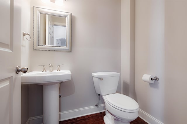 510 Cityhouse Ct Unit 406, Memphis, TN 38103 - half bathroom featuring baseboards, toilet, and wood finished floors