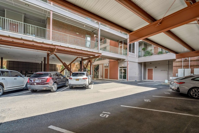 510 Cityhouse Ct Unit 406, Memphis, TN 38103 - covered parking lot featuring stairway