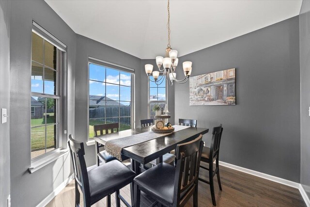 40 Chesnut Spring Dr, Oakland, TN 38060 - dining area with a chandelier, baseboards, and wood finished floors