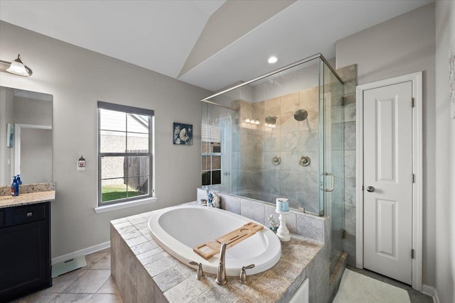 40 Chesnut Spring Dr, Oakland, TN 38060 - full bath featuring a stall shower, a garden tub, vanity, lofted ceiling, and baseboards