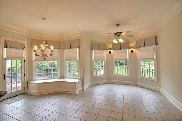 spare room with a chandelier, crown molding, baseboards, and a ceiling fan