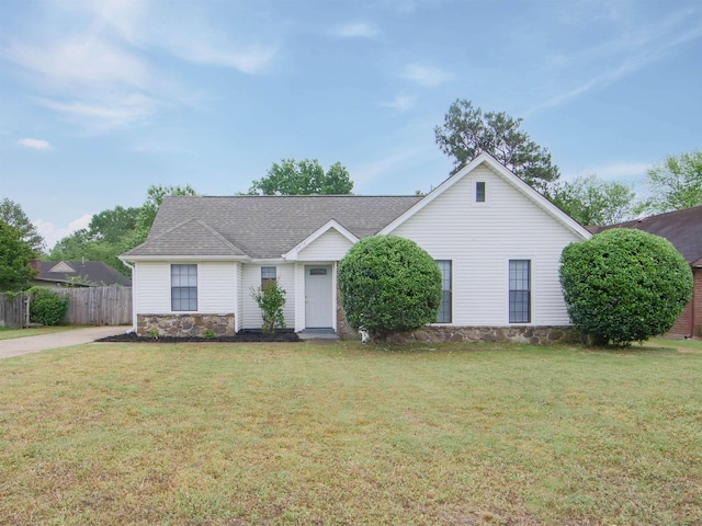 single story home with stone siding and a shingled roof