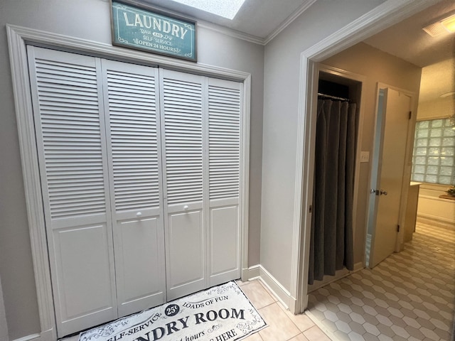 5068 Walnut Grove Rd, Memphis, TN 38117 - corridor with light tile patterned floors and crown molding