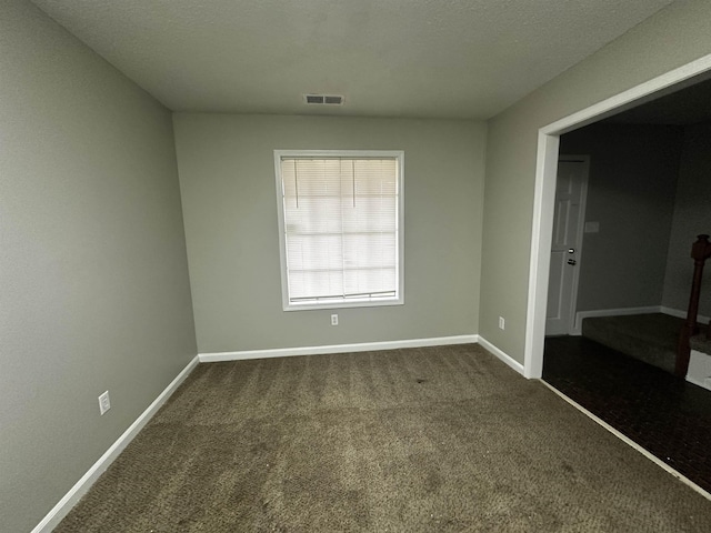 2980 Ridgeway Dr, Memphis, TN 38115 - spare room featuring dark colored carpet and baseboards
