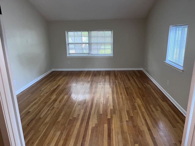 2902 Capri St, Memphis, TN 38118 - empty room with dark wood-style floors and baseboards