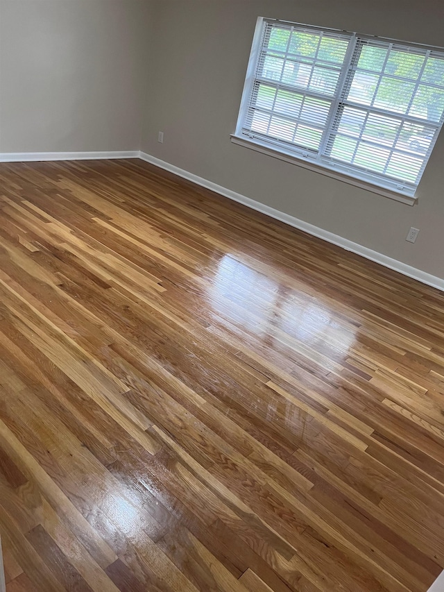 2902 Capri St, Memphis, TN 38118 - empty room featuring dark wood finished floors and baseboards