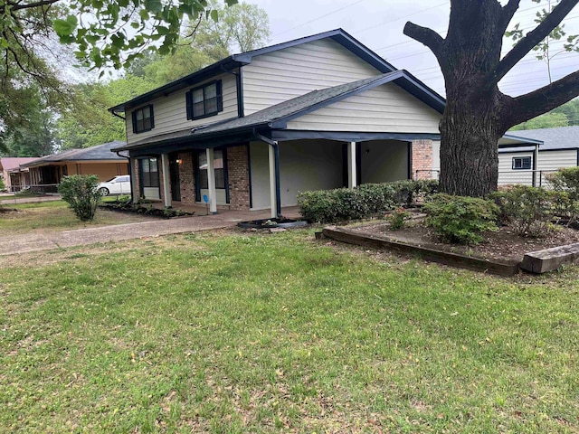 2902 Capri St, Memphis, TN 38118 - view of front of home featuring a front lawn, brick siding, and covered porch