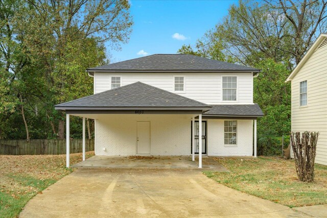 4657 Christyshire Dr, Memphis, TN 38128 - traditional home featuring roof with shingles, concrete driveway, a carport, and brick siding
