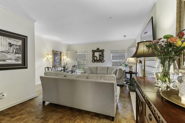 living area featuring ornamental molding and baseboards