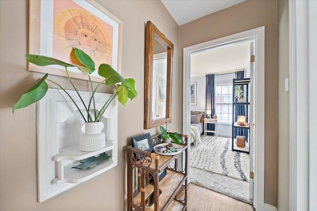 entryway with wood finished floors