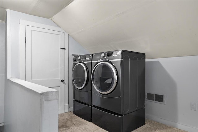washroom featuring separate washer and dryer and carpet