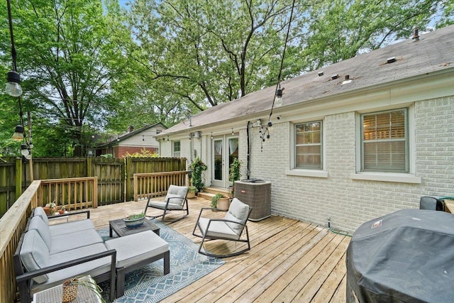 wooden terrace with central AC unit, area for grilling, an outdoor living space, fence, and french doors