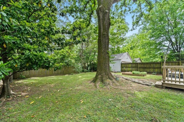 view of yard featuring an outbuilding and a storage shed