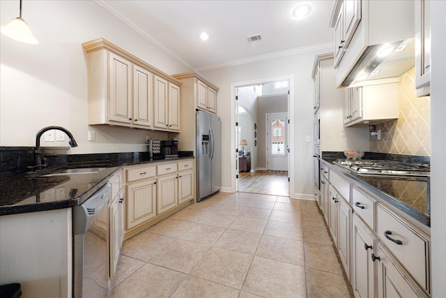 1685 Jennings Mill Ln, Collierville, TN 38017 - kitchen featuring a sink, stainless steel appliances, ornamental molding, light tile patterned floors, and backsplash