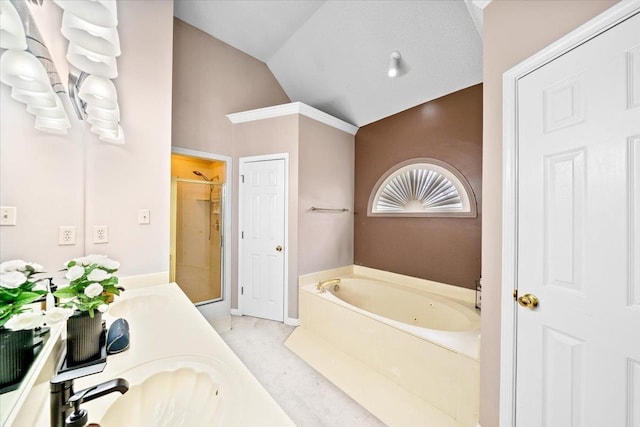 8606 Meadow Green Dr, Memphis, TN 38016 - full bathroom with lofted ceiling, a stall shower, a whirlpool tub, and double vanity