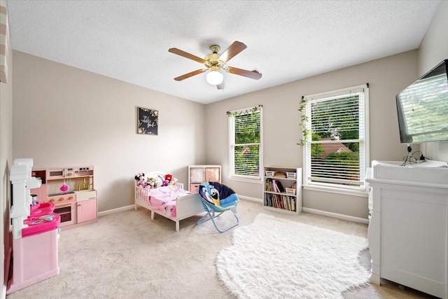 8606 Meadow Green Dr, Memphis, TN 38016 - bedroom featuring carpet flooring, baseboards, ceiling fan, and a textured ceiling