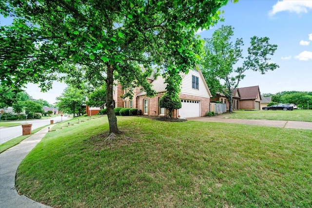 8606 Meadow Green Dr, Memphis, TN 38016 - view of front facade featuring an attached garage, driveway, and brick siding