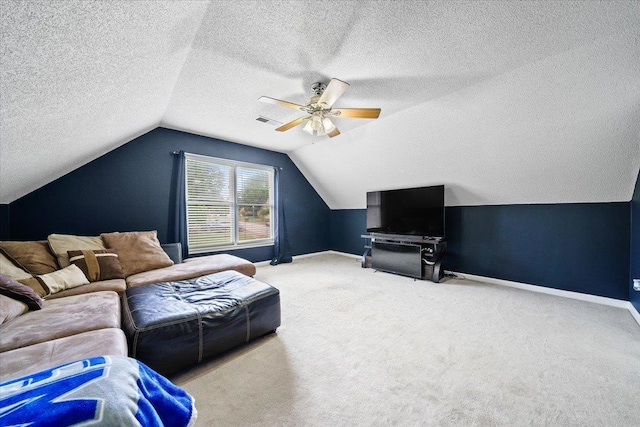 8606 Meadow Green Dr, Memphis, TN 38016 - carpeted living area featuring ceiling fan, baseboards, vaulted ceiling, and a textured ceiling