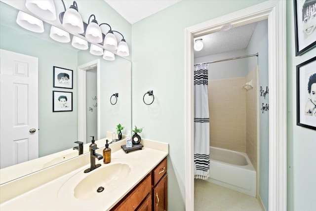 8606 Meadow Green Dr, Memphis, TN 38016 - full bath featuring vanity, tile patterned flooring, a textured ceiling, and shower / bath combo