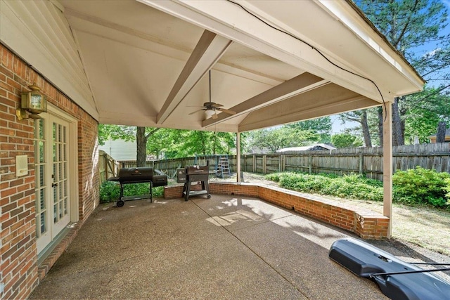 8606 Meadow Green Dr, Memphis, TN 38016 - view of patio featuring french doors, a fenced backyard, ceiling fan, and grilling area