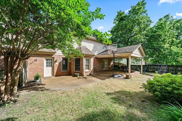 8606 Meadow Green Dr, Memphis, TN 38016 - back of property featuring a patio area and brick siding