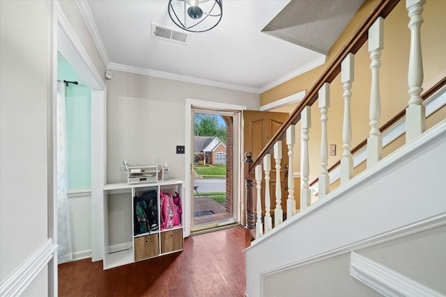 8606 Meadow Green Dr, Memphis, TN 38016 - entryway featuring wood finished floors, ornamental molding, and stairs