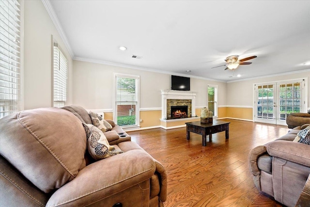 8606 Meadow Green Dr, Memphis, TN 38016 - living room with wood finished floors, ornamental molding, a fireplace, a ceiling fan, and baseboards