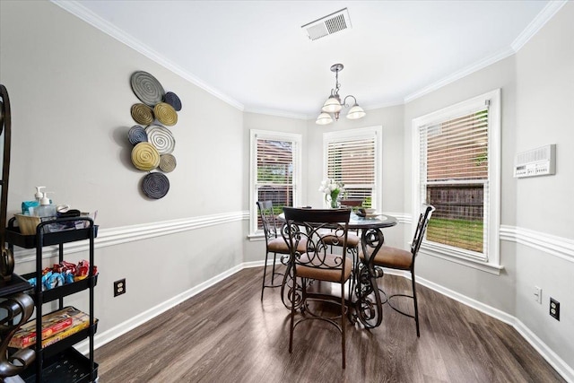 8606 Meadow Green Dr, Memphis, TN 38016 - dining room with dark wood finished floors, plenty of natural light, baseboards, and crown molding