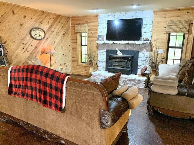 4560 Bishop Rd, Middleton, TN 38052 - living room with wooden walls, hardwood / wood-style floors, and a stone fireplace
