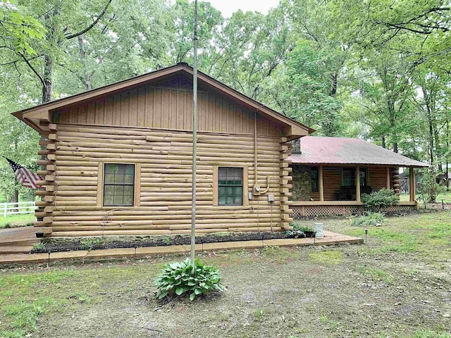 4560 Bishop Rd, Middleton, TN 38052 - view of side of home featuring log siding and a porch