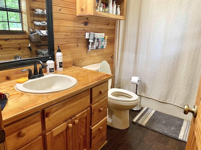 4560 Bishop Rd, Middleton, TN 38052 - full bath with wood finished floors, toilet, vanity, and wood walls