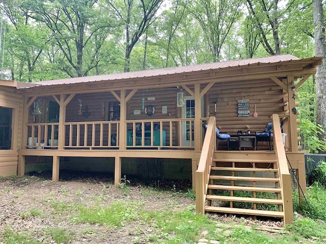 4560 Bishop Rd, Middleton, TN 38052 - rear view of house featuring stairs, metal roof, and log exterior