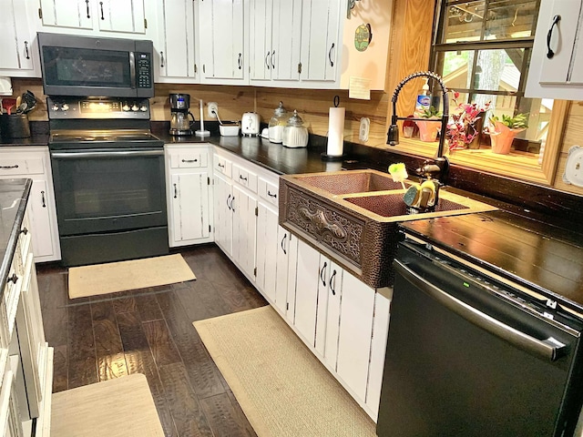 4560 Bishop Rd, Middleton, TN 38052 - kitchen featuring black appliances, dark countertops, white cabinets, and dark wood-style floors
