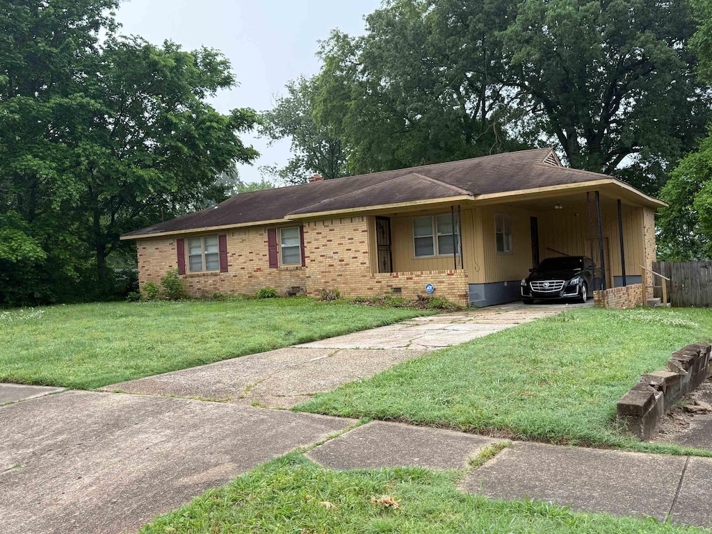 1975 Wellons Ave, Memphis, TN 38127 - ranch-style house featuring concrete driveway, a carport, crawl space, and brick siding