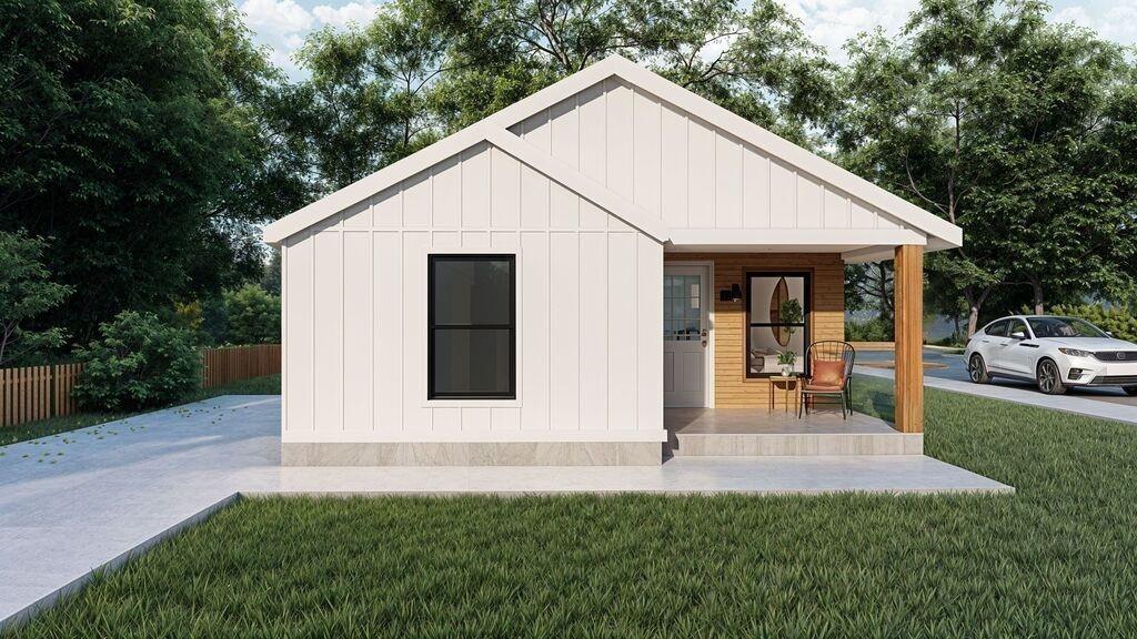 1648 Gill Ave, Memphis, TN 38106 - view of front of house featuring covered porch and board and batten siding