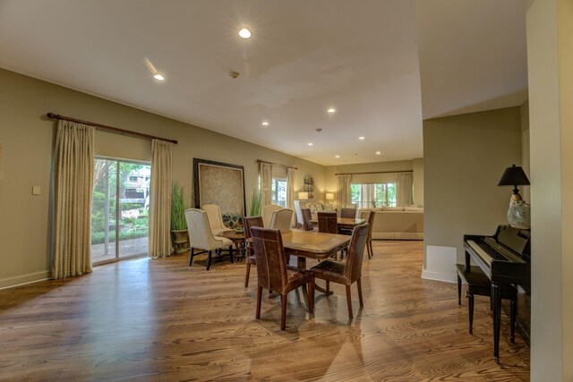 dining area with wood finished floors, recessed lighting, and baseboards